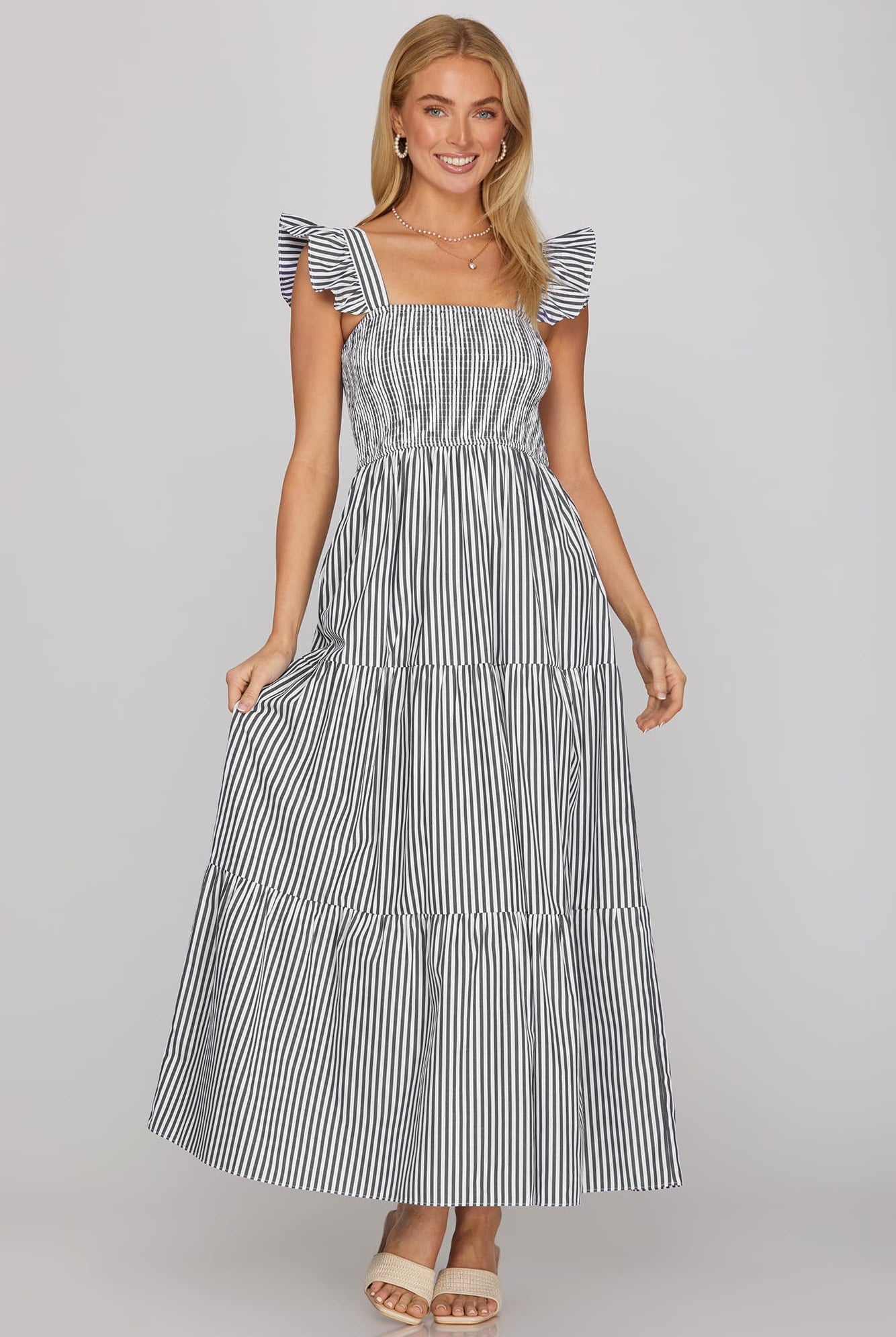 navy blue and white tiered midi dress with ruffle sleeves and smocked bodice