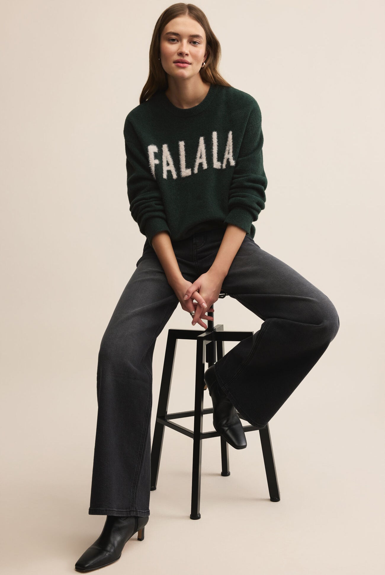 Dark Green holiday sweater with white lettering