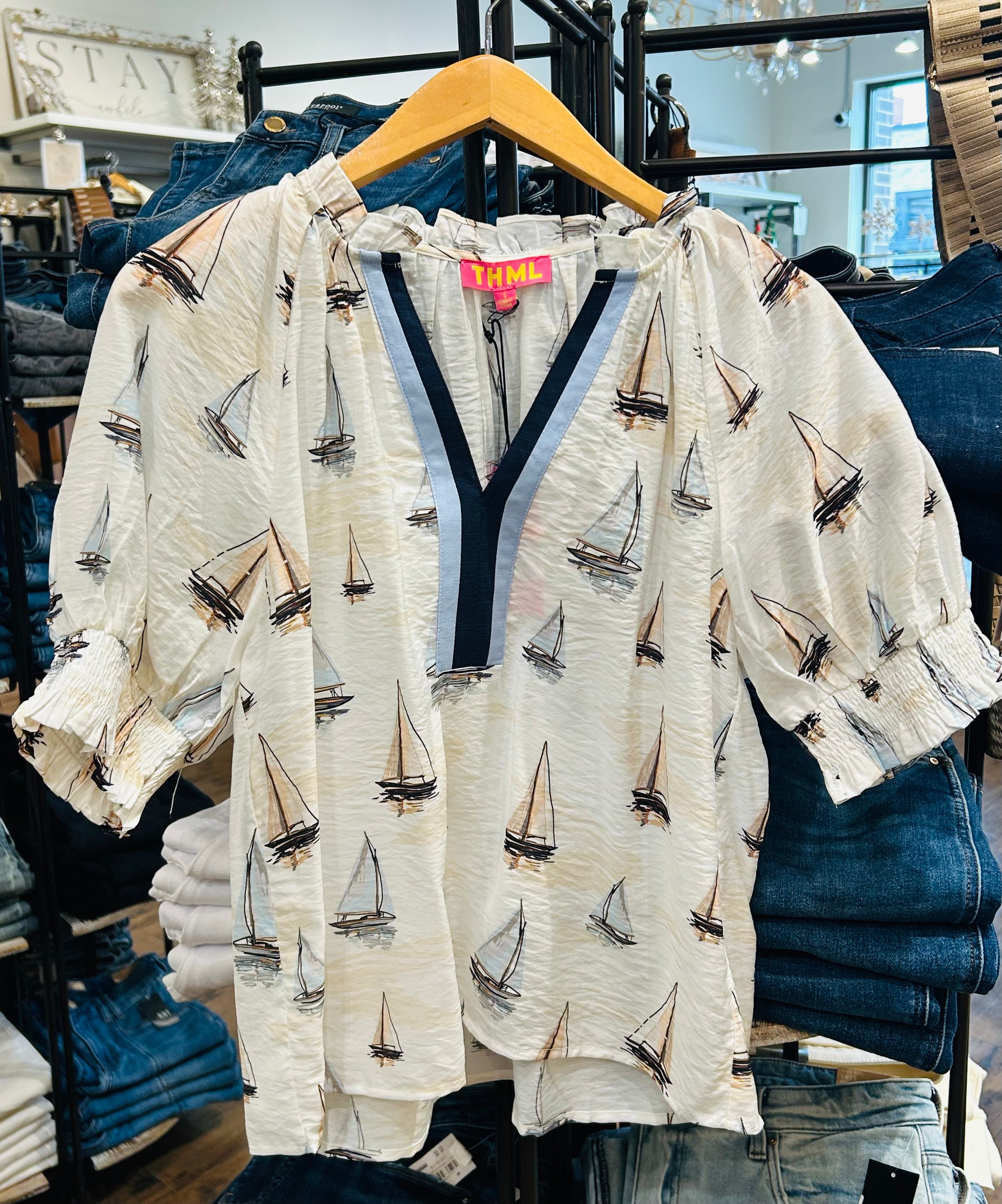 White blouse with sailboat pattern