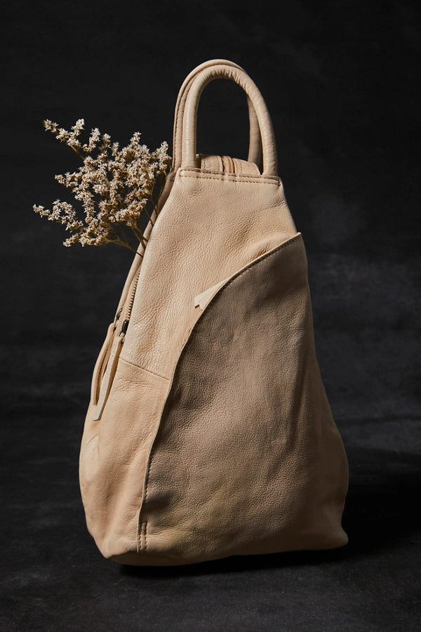 Beige leather tote bag with a handle