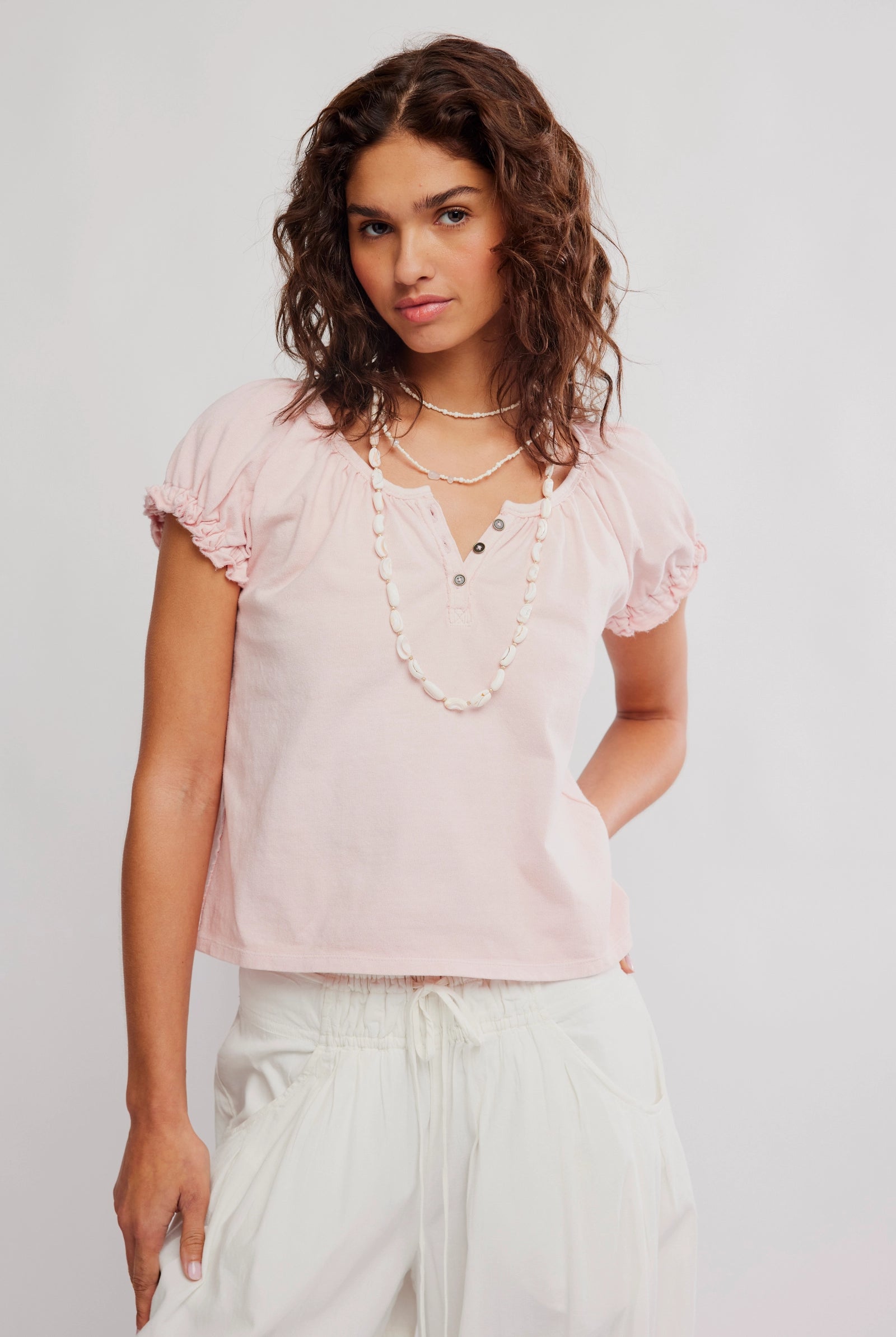 Free People baby pink short puff sleeve top with henley detail