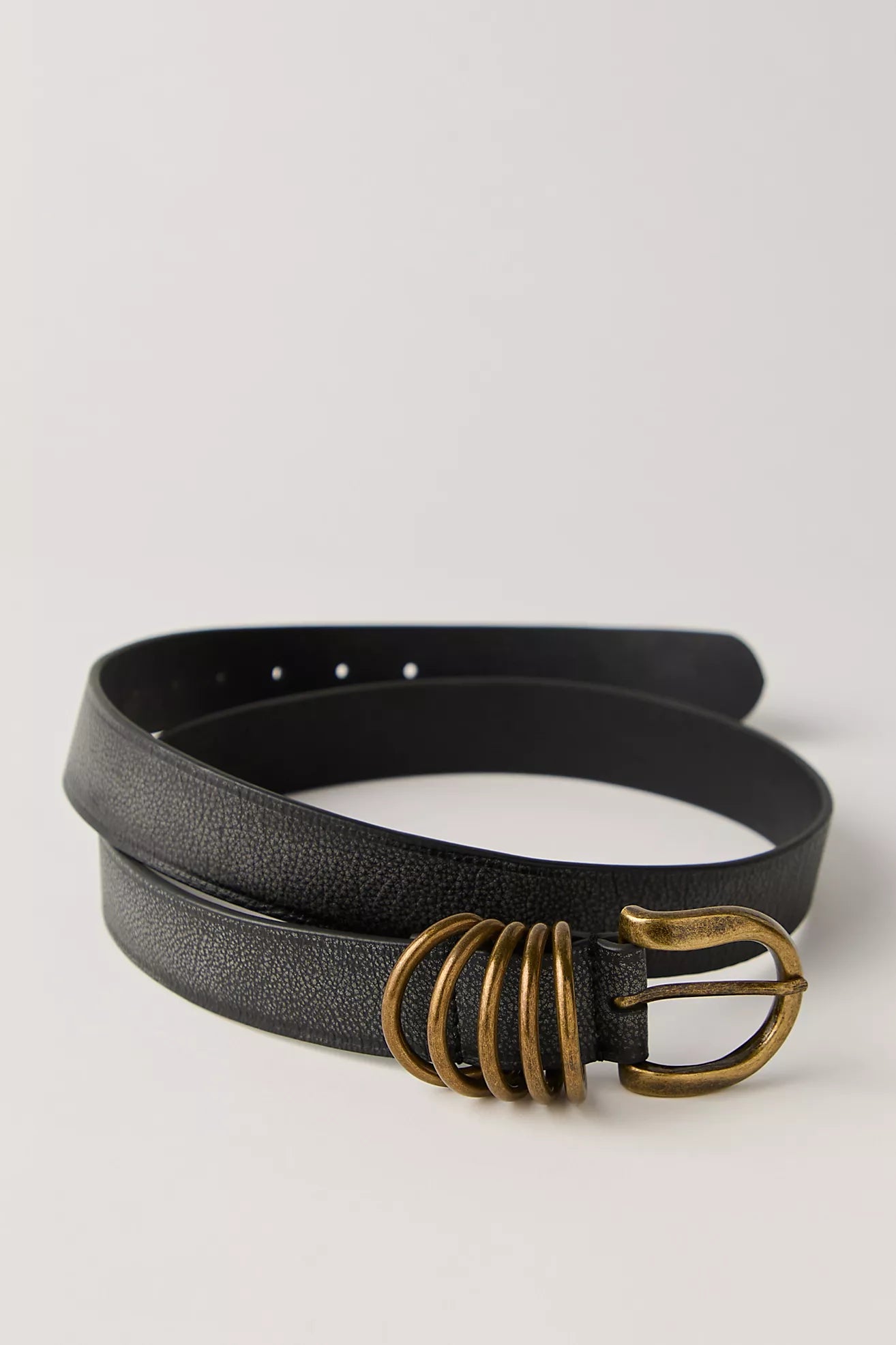 Black leather belt featuring gold hardware.