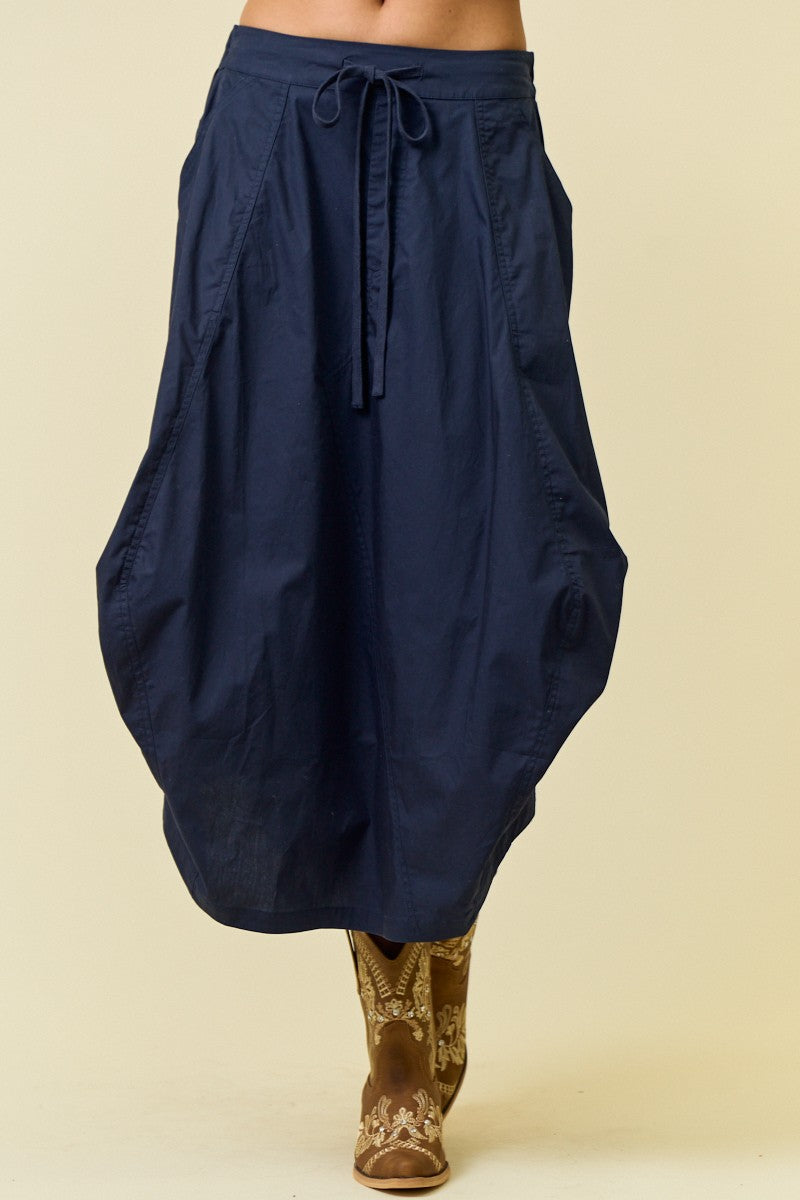 navy blue midi skirt with drawstring waist and side tuck detail