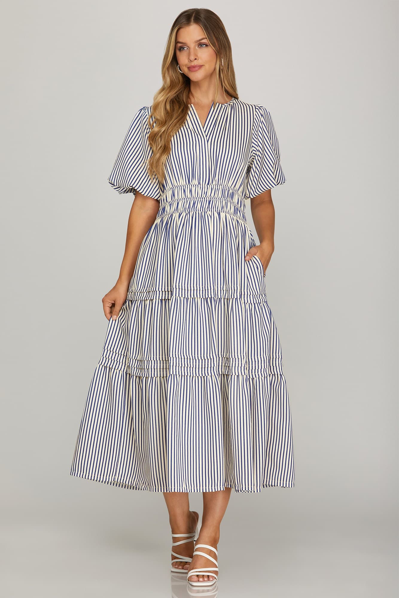 striped white and navy midi tiered dress with pockets and puff sleeves