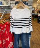 White Long Sleeve Sweater With Black Stripes.