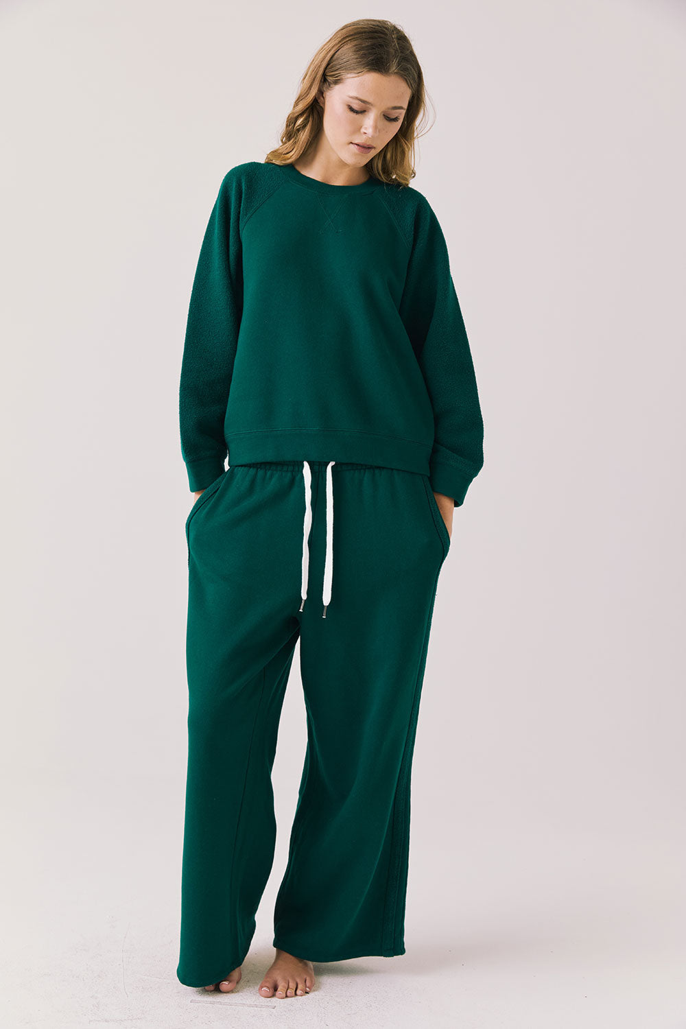 Woman wearing  green sweat pants 