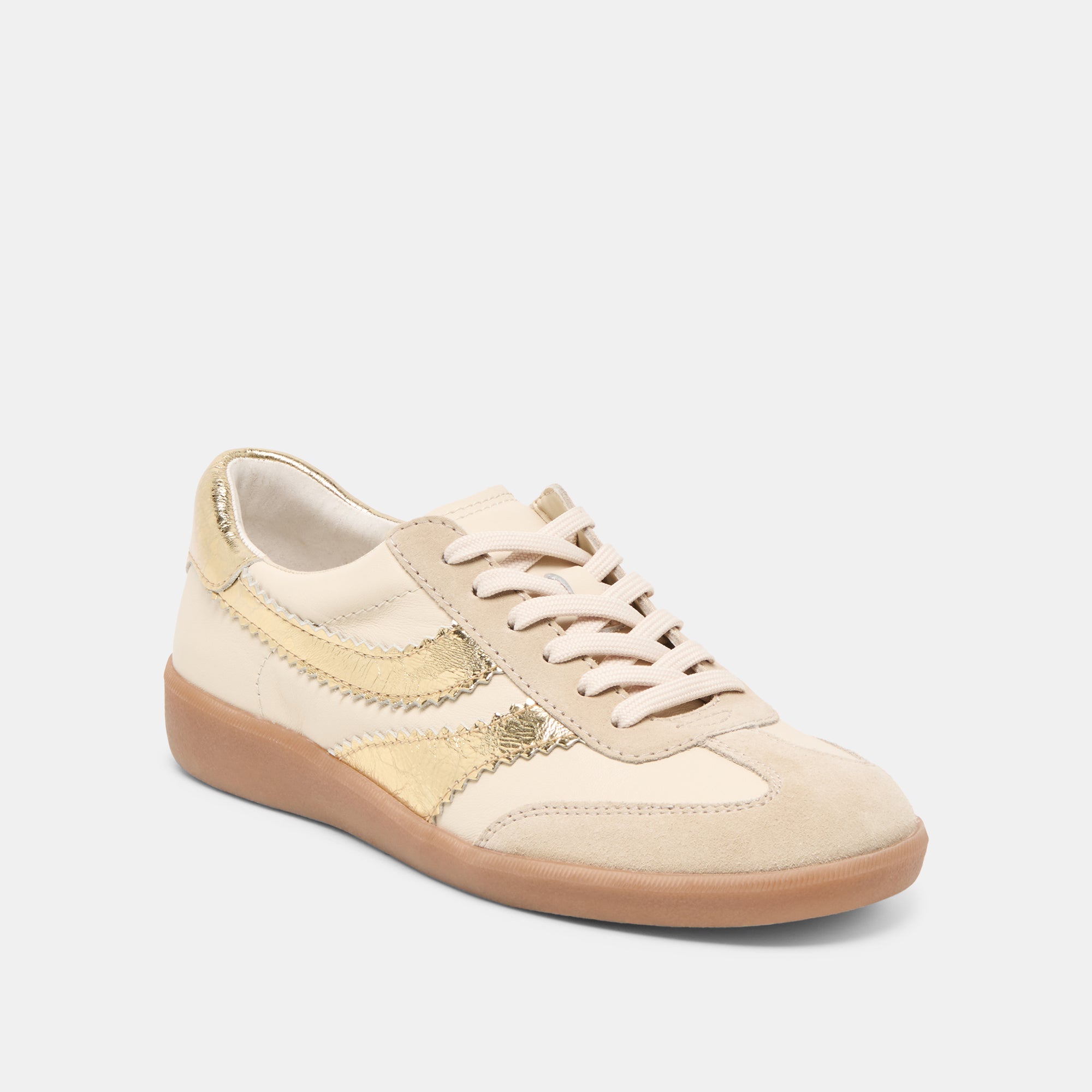 Beige sneaker with gold accents 