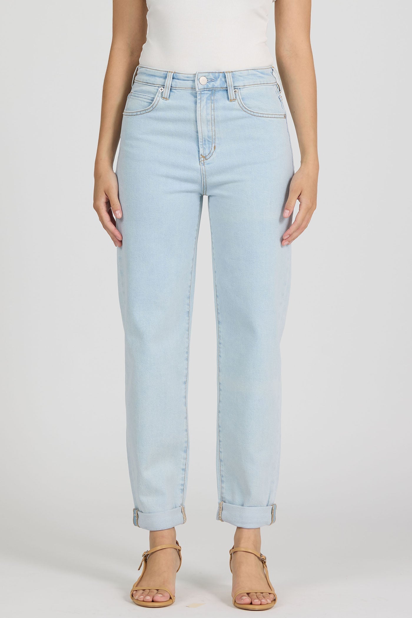light wash blue denim tapered jeans high rise with rolled cuffed hems