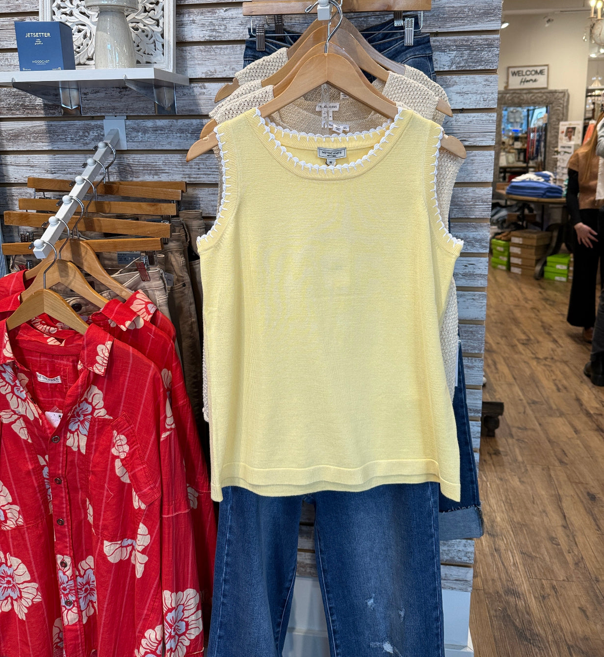 Sleeveless yellow top with white scalloped detail