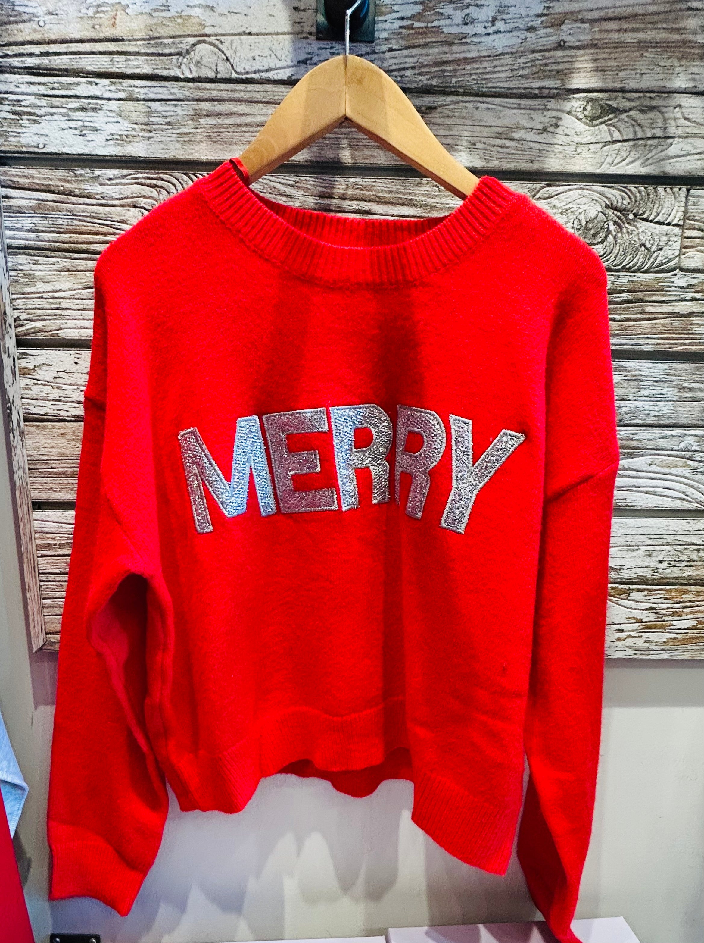 Red sweater with 'MERRY' in silver letters 