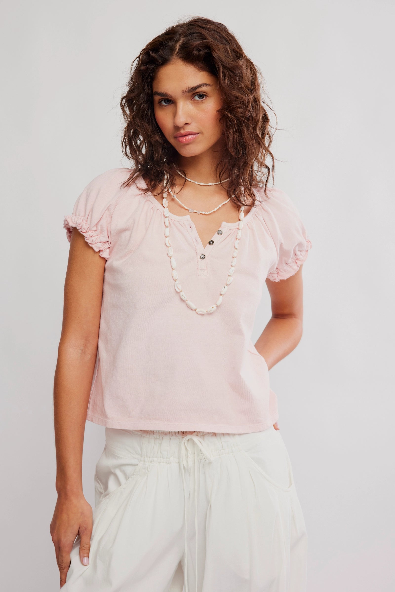 Free People baby pink short puff sleeve top with henley detail