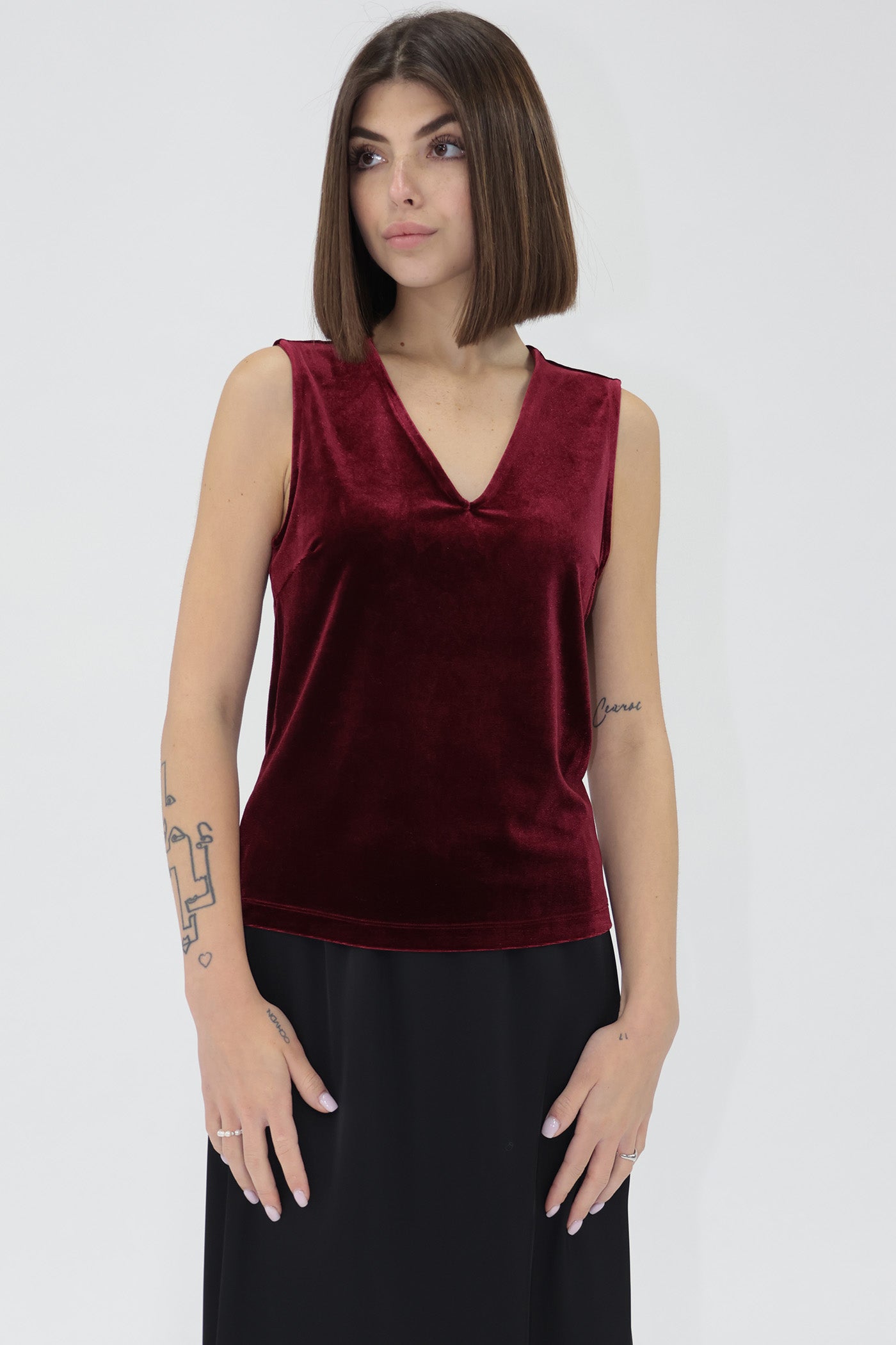 Woman wearing a red velvet another love top 