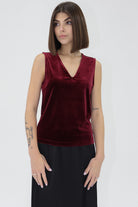 Woman wearing a red velvet another love top 