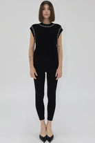 Woman Wearing Sleeveless Black Sweater with Embellishment detail