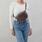 HOBO brown polished leather belt bag with zipper pouch