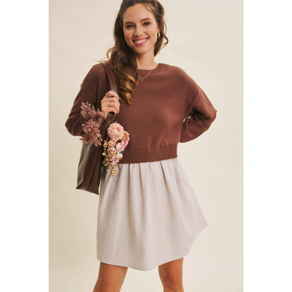 brown sweater over a white shirt dress combo piece.