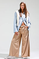 tan wide leg corduroy pants with white polka dots and drawstring waist