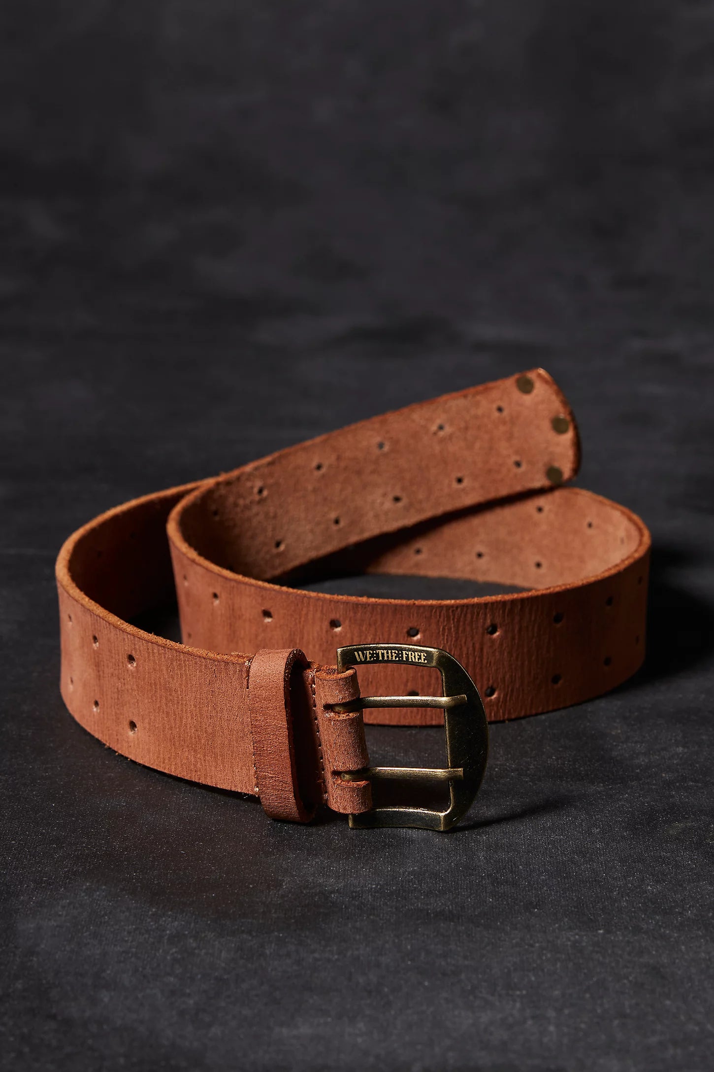 Free People belt is featured in a luxe leather fabrication, medium width design