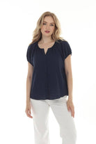 Lucy Button Top – A versatile blouse featuring a soft button-front design with gently gathered sleeves for a relaxed yet polished look. 