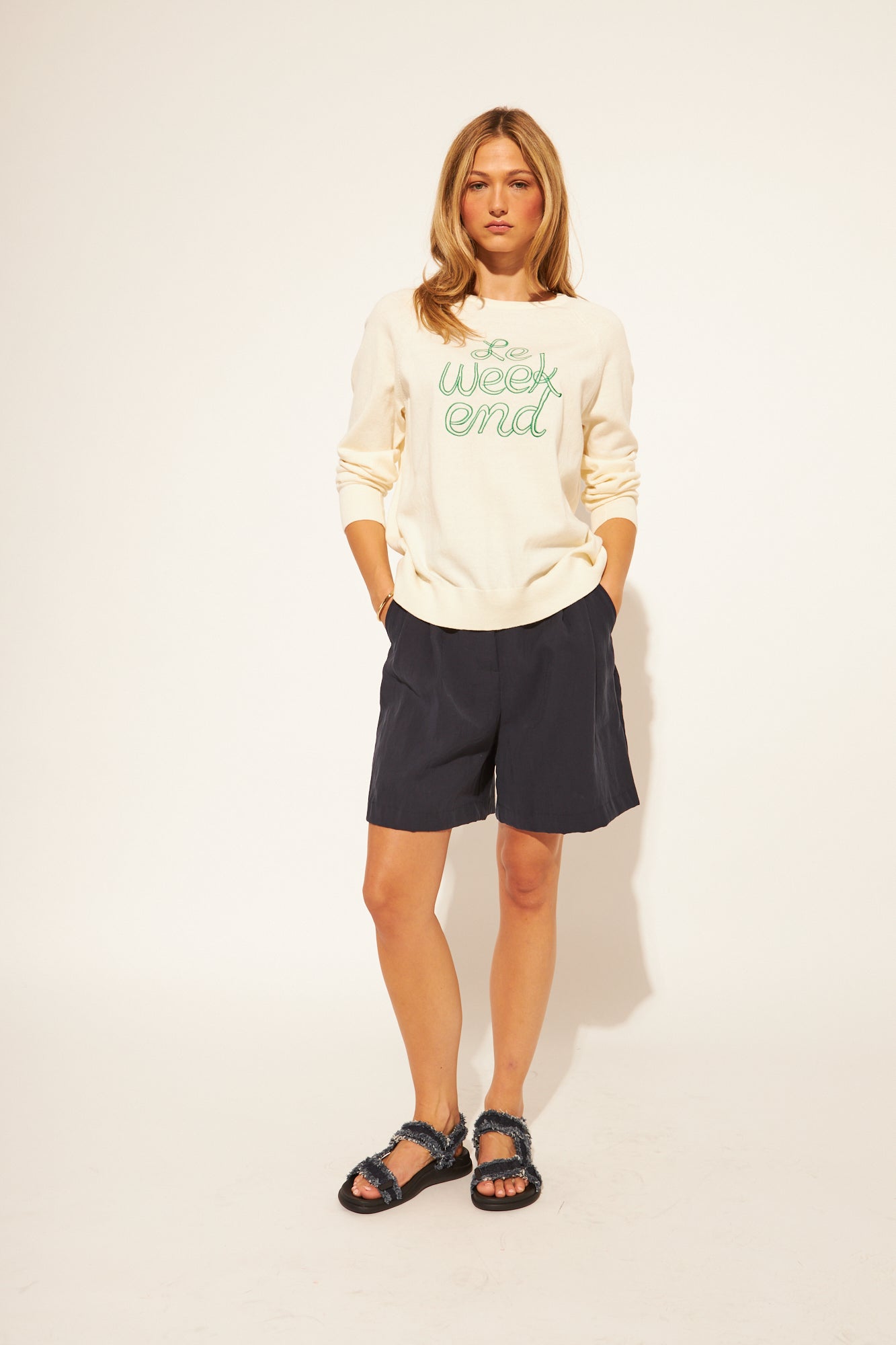 Beige Sweater with Green Lettering