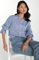 Light blue striped button up shirt, with adjustable sleeve detail