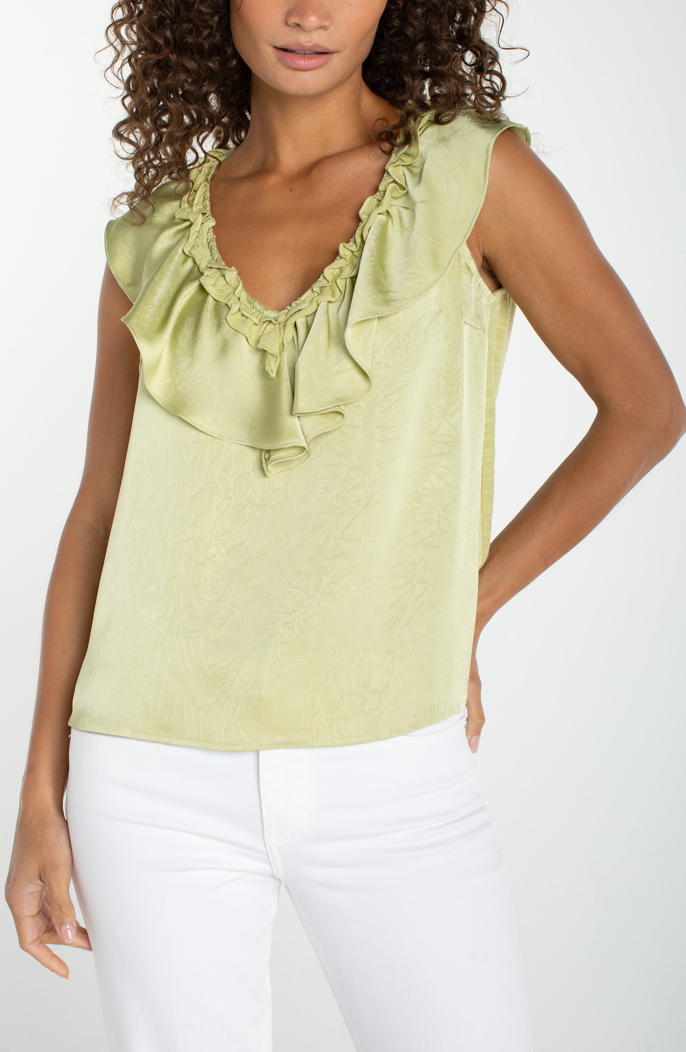 Sleeveless, ruffle-front, green blouse