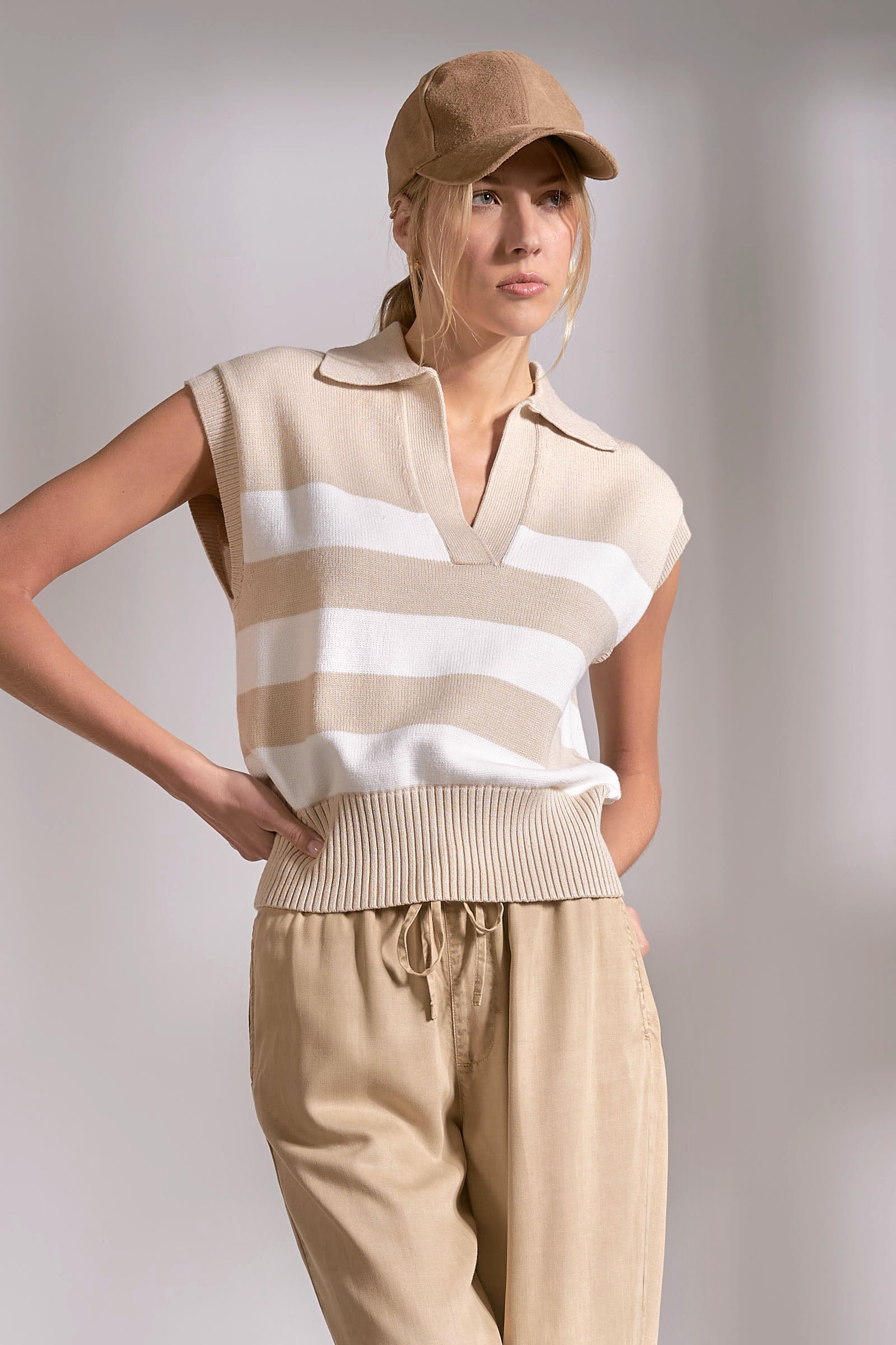 beige and white striped sleeveless collared sweater vest